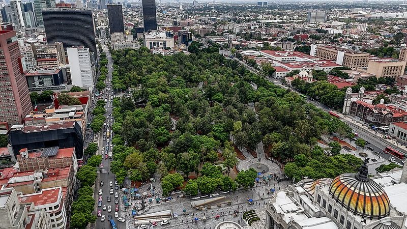 Aerial view of the tree-lined Alameda Central park surrounded by Mexico City buildings