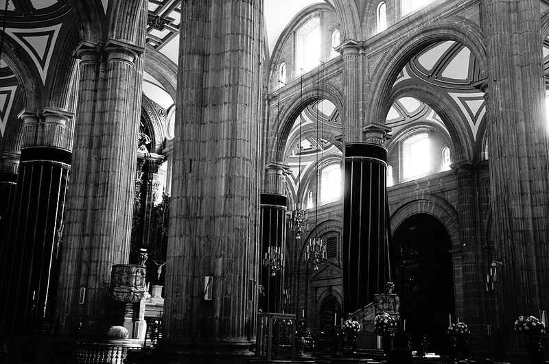 Ornate interior nave of the Metropolitan Cathedral showing gilded altars and vaulted ceiling