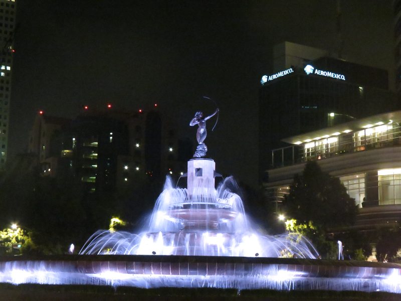Diana the Huntress Fountain illuminated at night on Paseo de la Reforma Mexico City
