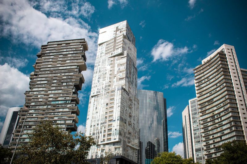 Contemporary glass skyscrapers rising along Paseo de la Reforma in the Mexico City financial district