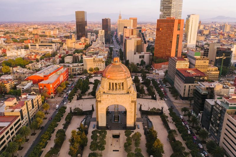 Stunning aerial view of the Monument to the Revolution surrounded by Mexico City urban landscape