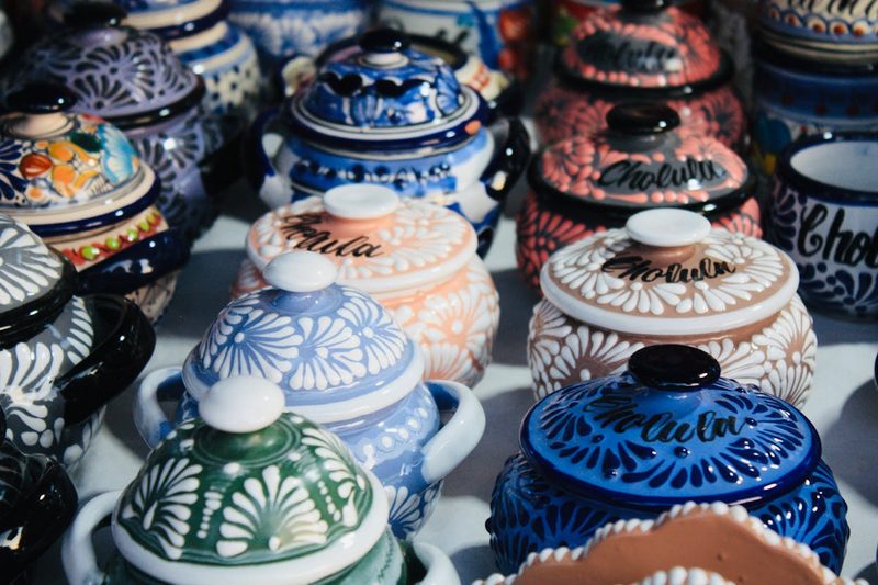 Vibrant Talavera pottery collection from Cholula Mexico featuring intricate hand-painted designs