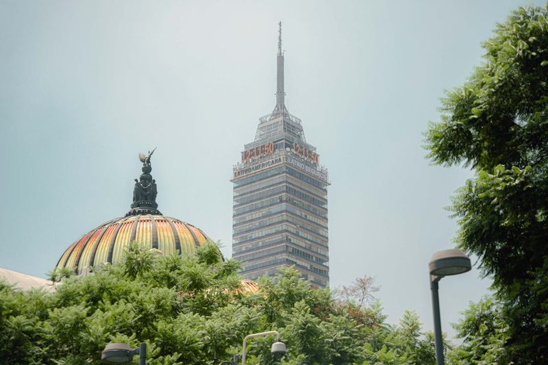 View of Torre Latinoamericana tower and the Bellas Artes dome against the Mexico City skyline
