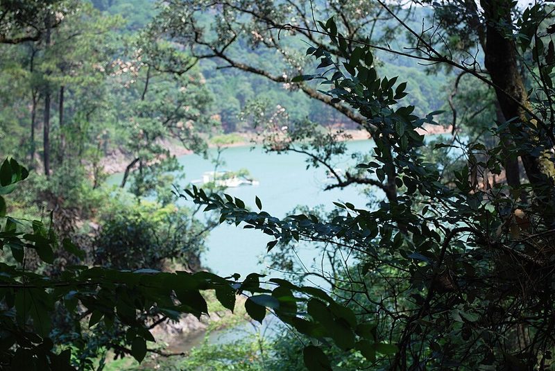 Scenic approach to the lake at Valle de Bravo surrounded by forested hills