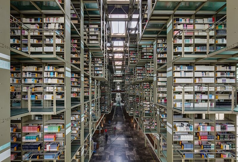 Dramatic interior of the Biblioteca Vasconcelos with suspended bookshelves and modern architecture