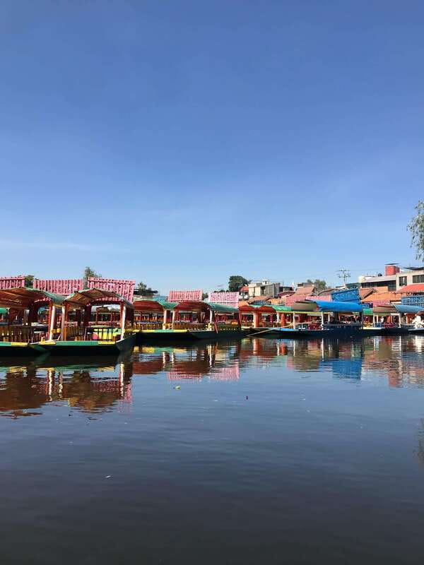 "Floating Party in Xochimilco: Canals, Tequila, and Tradition" - Games, music, and traditional activities