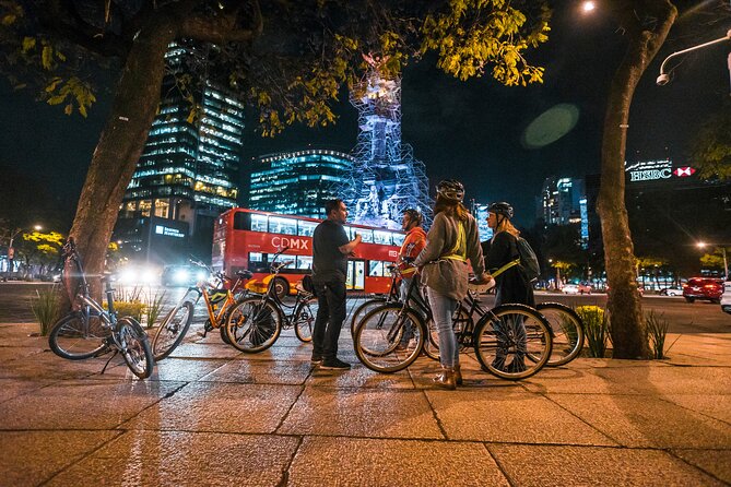 Night Street Food & Bike Tour / Small Groups /All Inclusive - Two illuminated monuments, two very different moods