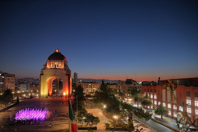 Night Tour of Mexico City Panoramic Ride on a Double-Decker Bus - Benito Juárez Hemicycle in evening light