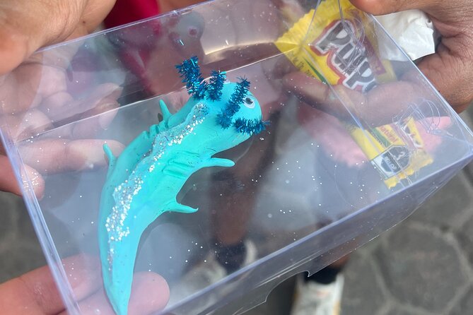 Xochimilco Boat Ride with Kids - Making a souvenir on the boat